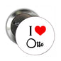 Round pinback badge with I and Otto text, red heart icon