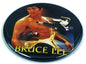 Round BRUCE LEE pin button with martial arts action graphic and yellow BRUCE LEE text