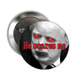 Round pinback button with skull face artwork, red eyes, and “He scares me” text