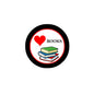 2.25-inch pinback badge: black rim, red heart, 'BOOKS' text, stacked book graphic