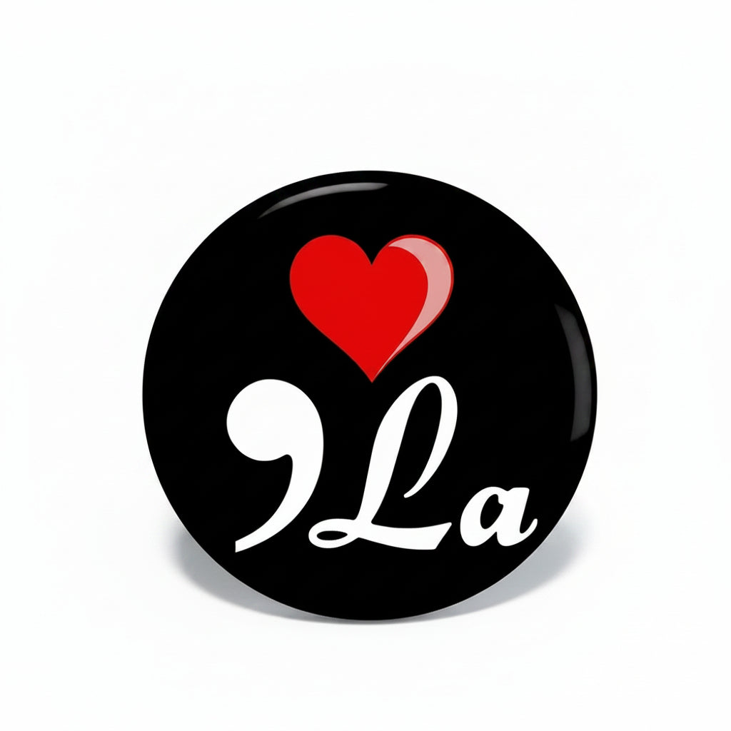 1.25-inch black pinback button with red heart and white “9La” script design