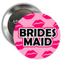 1.25-inch bridesmaid pinback badge with pink lips and 'BRIDES MAID'.