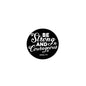 Black round pinback button with white text "Be Strong and Courteous"