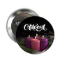Round Advent pinback brooch with black design, white “Advent” script, and candle graphic