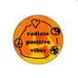 Orange pinback button with peace sign and phrase "radiate positive vibes"