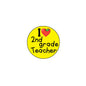 Round yellow pinback button with “I 2nd grade Teacher” text and heart icon