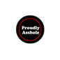 Black round pinback button with red outline and “Proudly Asshole” text
