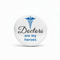 Round blue and white Doctors are my heroes pin with caduceus emblem, 2.25-inch
