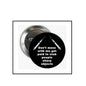 2.25-inch black round pinback button with white text and teal accents