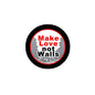Round black pinback button with red and white "Make Love not Walls" logo