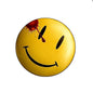 Yellow smiley face button pin with black eyes and red splatter accent