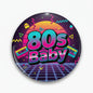 2.25-inch retro button pin with 80s Baby design, cassettes and lightning on dark purple