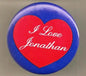 Heart-shaped pinback button with red center, blue border, and white "I Love Jonathan" text