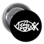 Black round pinback button with white fish-style Jesus symbol and lettering