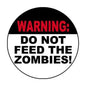 Round pinback button: “WARNING! DO NOT FEED THE ZOMBIES!”