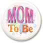 Round pinback button with "Mom To Be" colorful text and confetti swirls