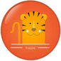 Orange tiger face pinback button, 2.25 in round with striped ears and smile.