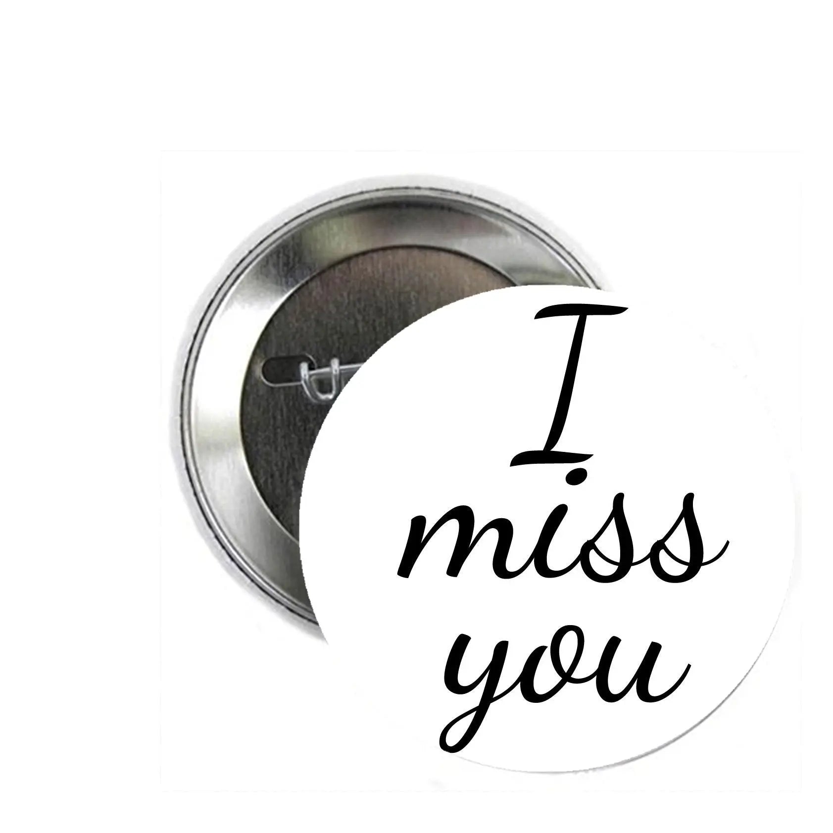 Round silver pinback button with 'I miss you' lettering