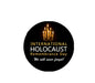 Round black pinback brooch with candles and 'International Holocaust Remembrance Day' text