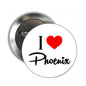 Round pinback badge with white “I ❤ Phoenix” graphic and red heart