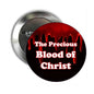 Religious pinback button with black face and red dripping text: The Precious Blood of Christ