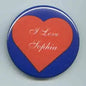 Heart pinback button: 'I Love Sophia' on orange center, blue border