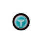 Round 2.25-inch pinback badge with black rim and teal medical academy logo