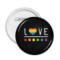 Round LGBT love pin badge with rainbow heart and colored dots on black background