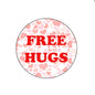 Round badge reel insert with “FREE HUGS” text on pink heart pattern
