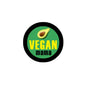 Round vegan mama badge pin, black rim and green center with avocado and yellow VEGAN text