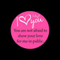 Pink round keychain charm with white I Love You text and message