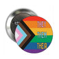2.25-inch circular pinback button with they/them/their text and rainbow stripes