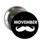 Black round Movember moustache pinback button with white text and metal back