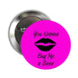 Beer-themed button pin with pink circle text "You Wanna Buy Me a Beer" and kiss lips