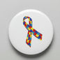 Autism awareness ribbon with colorful jigsaw puzzle-piece pattern