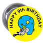 Round yellow pinback button with cartoon blue 9 and 'Happy 9th Birthday' text