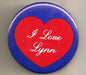 Blue pinback button with red heart and white “I Love Lynn” script