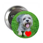 Round pinback button badge with light gray dog photo, green grass, red heart detail