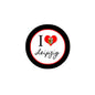 Circular pinback badge with black rim, white center, I heart Leipzig text and crest
