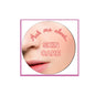 Round pink pinback badge with lips graphic and 'SKIN CARE' text
