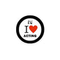 2.25-inch pinback button: black rim, white face with red heart and 'I ♥ ACTING'