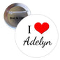 2.25-inch round pinback button: white face, red heart, black Adelyn script