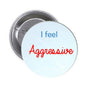 1.25-inch pinback button with light blue front text 'I feel Aggressive', silver back
