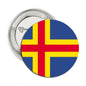 Flag pinback badge with blue background and red-and-yellow Nordic cross