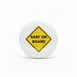 Round white fridge magnet with yellow diamond sign reading BABY ON BOARD