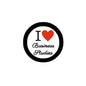 Circular black pinback button with red heart and “I ♥ Business Studies” text