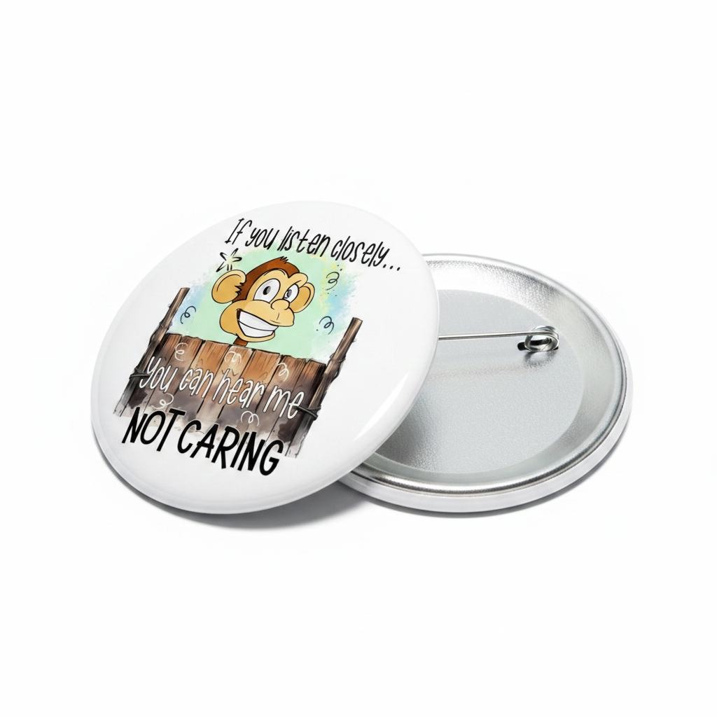 Round pinback button with cartoon character and quote on white face, silver back.