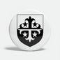 Round refrigerator magnet with black family crest shield and fleur-de-lis arms