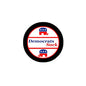 Black circular pin with red/white center reading 'Democrats Suck'.