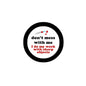 1.25-inch pinback button, black rim with white center and red/blue quote text